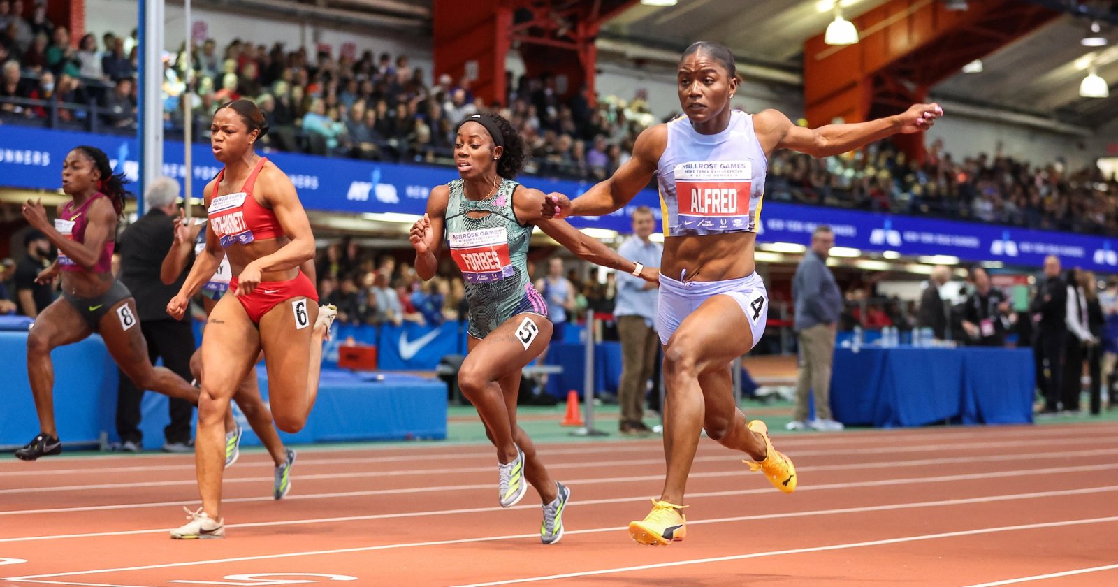 Julien Alfred wins the 60m at the 2024 Millrose Games in 6.99s.