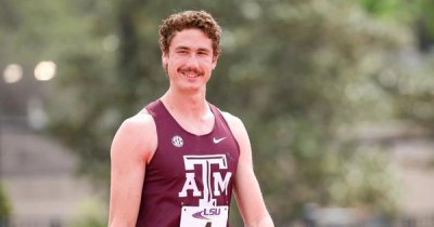Sam Whitmarsh smiling before racing at a Track & Field meet.
