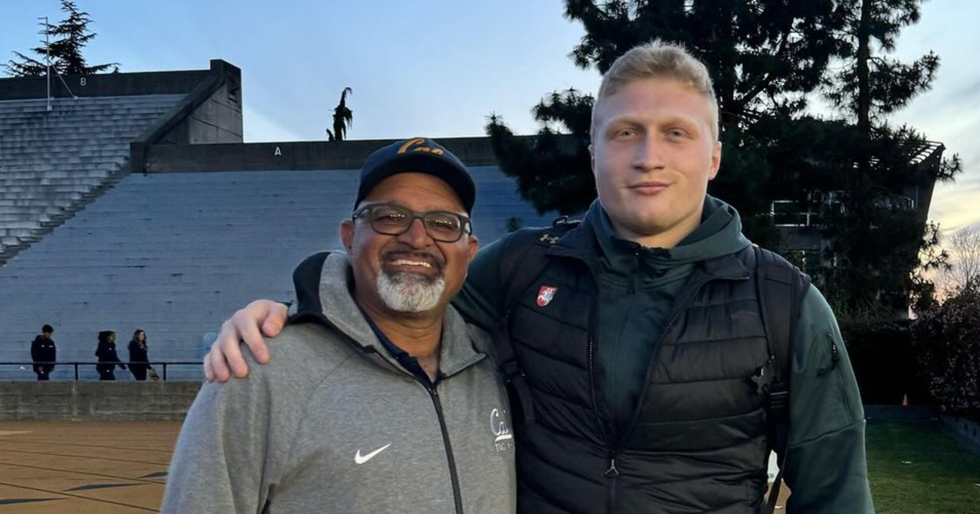 Mykolas Alknena with his discus Coach Mohamad Saatara.  
