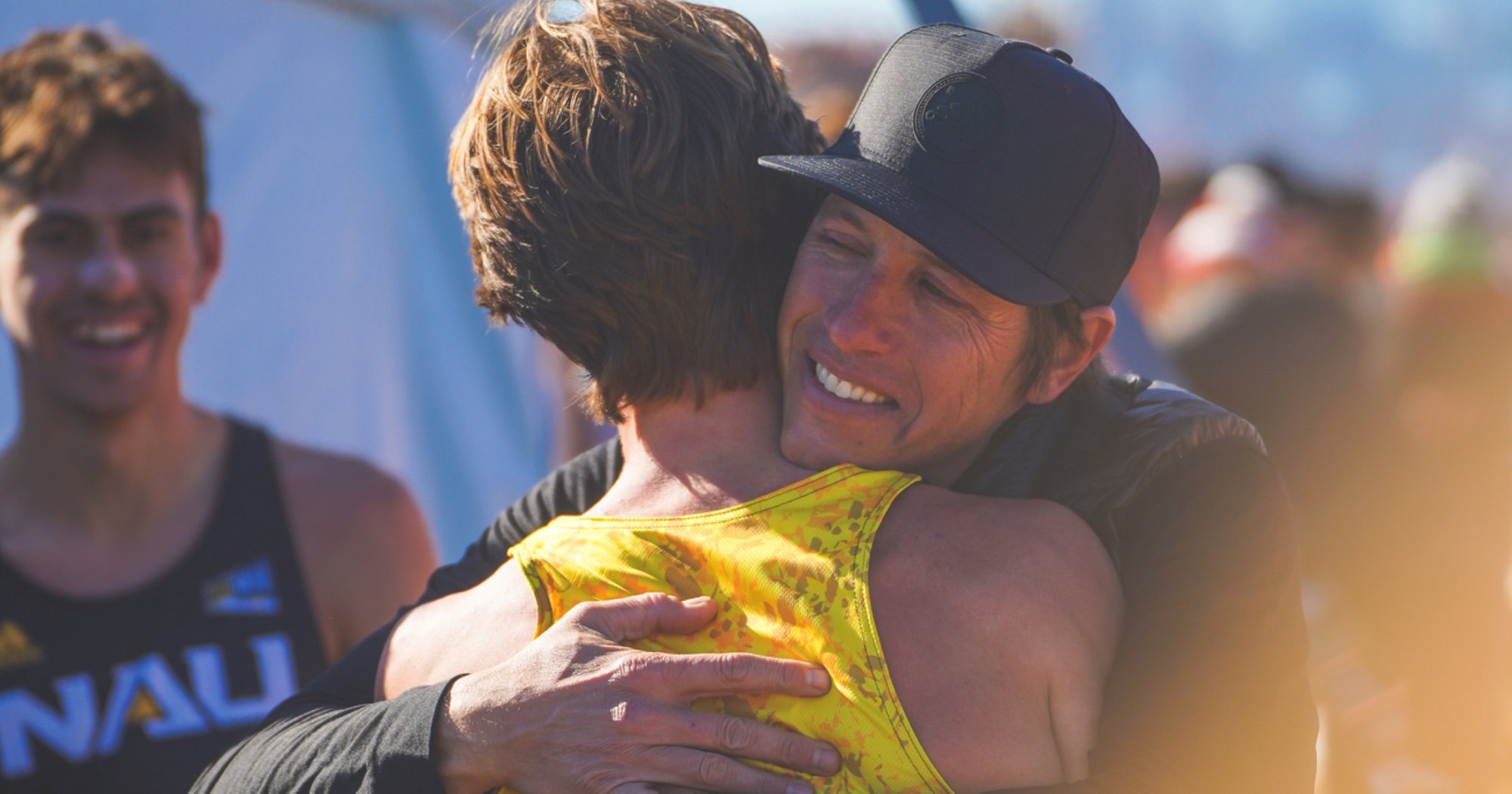 Mike Smith celebrates winning the 2022 NCAA Cross Country Championship men's team title.